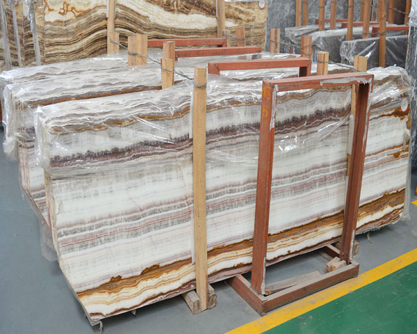 Golden amber wood grain white onyx marble slab