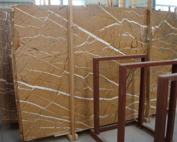 Imported rainforest golden brown marble from India